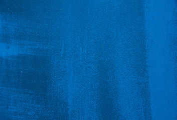 Abstract background. Streaks and scratches on the bright blue painted metal surface. Background,...