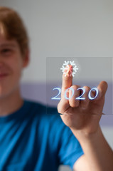 young boy presssing futuristic 2020 snow button