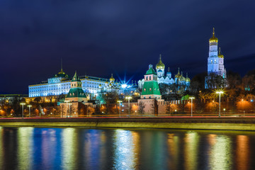 Illuminated Moscow Kremlin with Grand Kremlin Palace the government residence of president of Russia. View from the embankment of Moskva river. Evening urban landscape in the blue hour