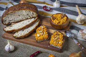 fresh bread with chickpeas and carrots hummus