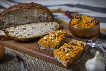 fresh bread with chickpeas and carrots hummus