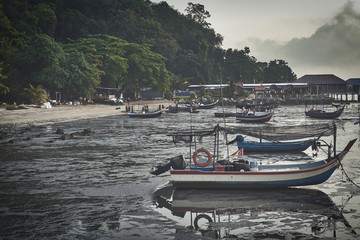mooed fishing boats at a malay fishing village