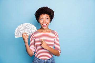 Photo of pretty sweet stunned girlfriend with astonishment on face smiling toothily pointing at fan...