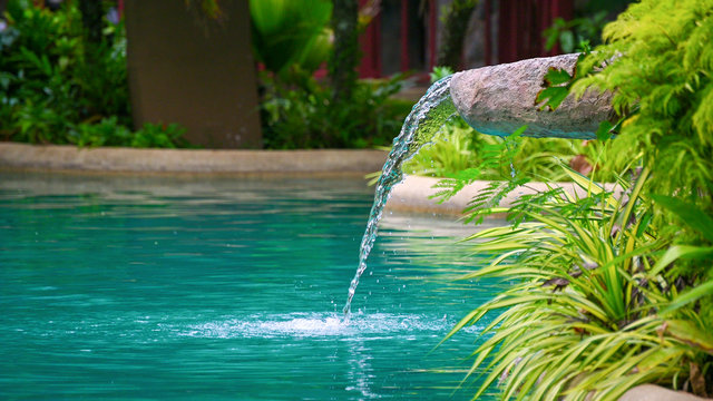 Water Flowing Water Falling Into The Pond, Decoration Of The Edge Of The Poo