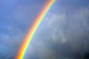 Rainbow in the rain. Nature, rainy, clouds, outdoors, weather, rainbows, color concept.