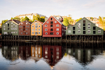 Fototapeta na wymiar Old wooden houses in the city of Trondheim/bakklandet in norway. River, buildings, city, architecture, unesco, heritage, travel, explore, houses, buildings concept.
