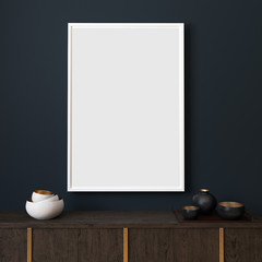 Picture mockup with white vertical frame on dark blue wall. Stylish dark interior with decor and wooden cupboard and blanket picture. Poster mockup. Minimalist modern interior design. 3D illustration.