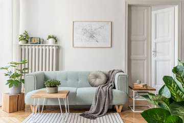 Modern scandinavian living room interior with stylish mint sofa, furnitures, mock up poster map,...