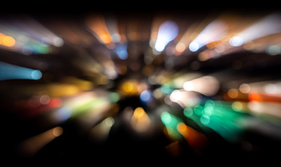 Fototapeta na wymiar blurred lights out of focus on dark background