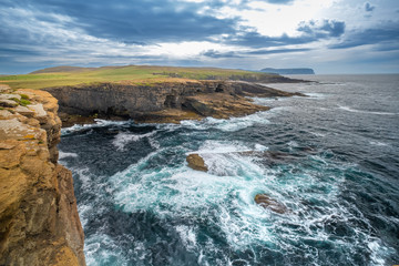 Obraz premium Stunning Yesnaby cliffs and the Yesnaby Castle Sea Stack on the west coast of Mainland Orkney island, Scotland