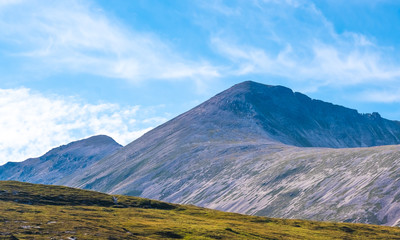 Naklejka premium Hiking the Torridon Hills, made of some of the oldest rocks in the world and among the most spectacular peaks in the British Isles. Highlands of Scotland.