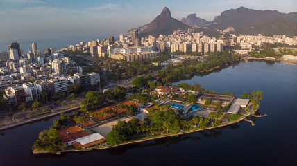 Fototapeta na wymiar Aerial panorama of the city lake of Rio de Janeiro with exclusive club Caiçaras on the island in Ipanema in the foreground and neighbourhood of Leblon and Two Brothers mountain in the background