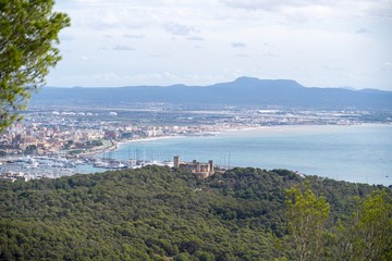 View of the city of Palma de Mallorca with The Bellver Castle, the Cathedral and Puig de Randa on frame
