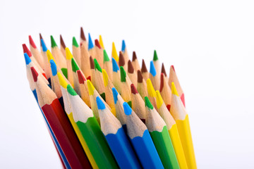 Colored pencils background.Color pencils on blue background.Close up. Many different colored pencils on blue background.Colorful pencil .Colorfull