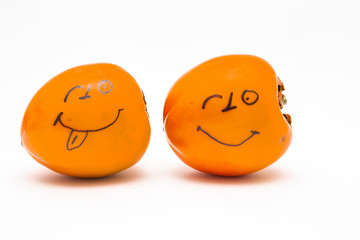 Smiley face.Paprika drawn on face on white background.