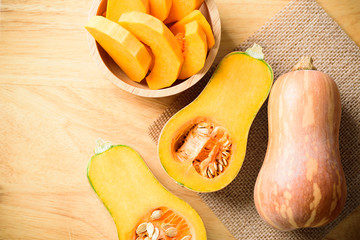 Half and slice butternut squash in a bowl for cooking