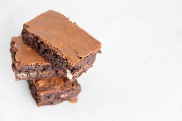 brownies chocolate three stacked on white background