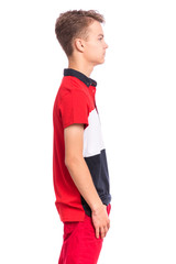 Fototapeta premium Handsome happy teen boy - side view, isolated on white background. Photo of adorable young smiling child looking at camera, front view. Emotional portrait of caucasian teenager - profile.