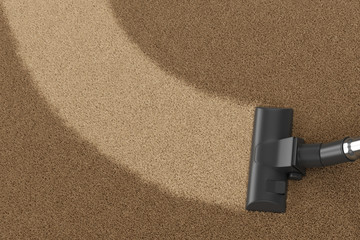 Vacuum cleaner brush on yellow dirty carpet