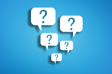 Question marks with speech bubbles on blue background