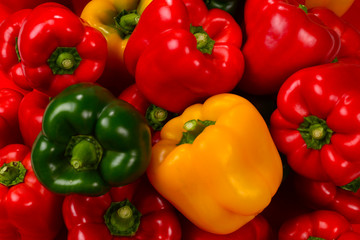 Fresh red, green, yellow bell pepper background.