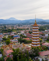 Aerial view of Chinese Temple Peak Nam Toong Pagoda during Sunny day located in the city of Kota Kinabalu, Sabah, Malaysia.