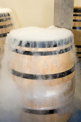 cellar white smoke dry ice in harvest wooden barrel for refresh grapes during fermentation