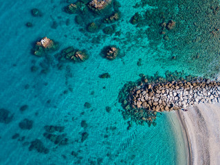 Aerial view of Tropea beach, crystal clear water and rocks that appear on the beach. Calabria, Italy