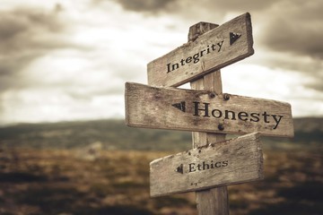 Integrity, honesty and ethics signpost in nature. Message, quotes, words, meaning, goals, company, business, rules, path concept. - obrazy, fototapety, plakaty
