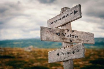 Responsibility, value, principle signpost in nature. Wooden boards, core values, business, quotes, message, corporate, team ,group, goals concept.