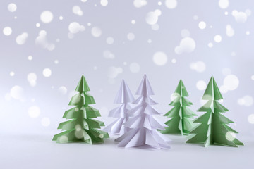 Christmas concept. Origami paper green Christmas trees.