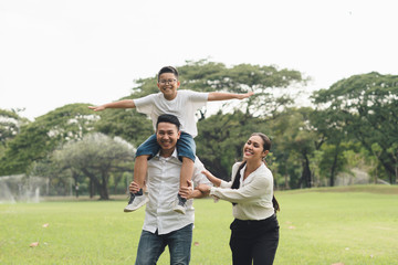 happy family  in the park, family asian group relation quality healthy support, home park .