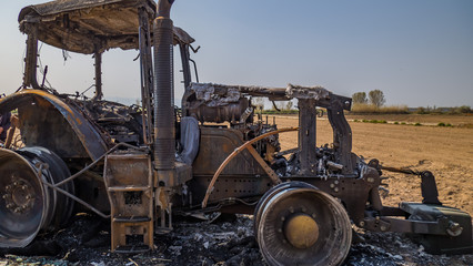 burned tractor defacement from vandalism