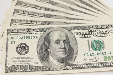 Texture of dollar bills. One hundred dollars. Close-up, macro.