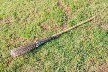 wood broomstick on the grasses