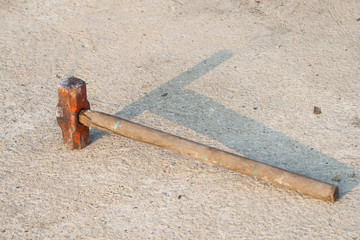 wood stick Sledge Hammer on the ground