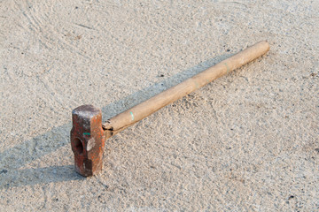 wood stick Sledge Hammer on the ground