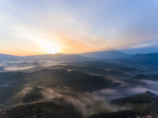 Aerial image of Amazing Beautiful Nature landscape view of Sunrise with  nature misty foggy and...