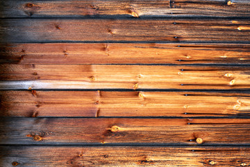 Golden and aged wooden rustic boards closeup. Background, texture, design and pattern concept.