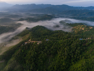 Aerial Drone image of beautiful Misty And Foggy dew during early morning sunrise at beautiful...