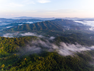 Aerial Drone image of beautiful Misty And Foggy dew during early morning sunrise at beautiful...