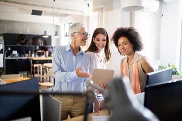 Cheerful coworkers in office during company meeting