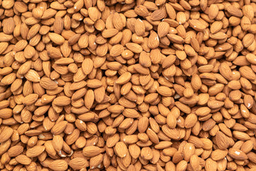 Dried almonds background, organic foods in market.