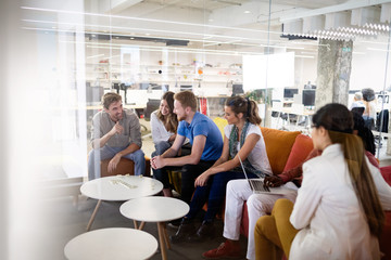 Carefree diverse office workers having fun during work break