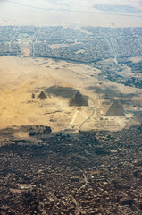 The Giza pyramid complex, also called the Giza Necropolis viewed from airplane window