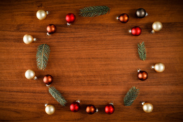 Naklejka na ściany i meble Flat background with wooden desk board top with christmas decorations and ornaments.