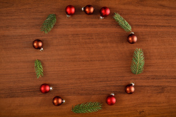 Flat background with wooden desk board top with christmas decorations and ornaments.
