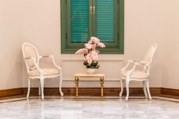 Antique living room set and green widow with flower in vase decoration concept interior