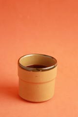 earthenware glass filled with red wine