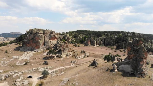 AERIAL drone flying along two stone phrygian structures in Phryg Valley Turkey